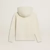 Sudadera con capucha en blanco desgastado con bordado dorado en la parte delantera.