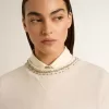 Sudadera corta de algodón color crema para mujer con cristales en la parte delantera Sudadera corta de algodón color crema para mujer con cristales en la parte delantera
