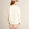 Sudadera en blanco desgastado con letras doradas multicolores en la parte delantera