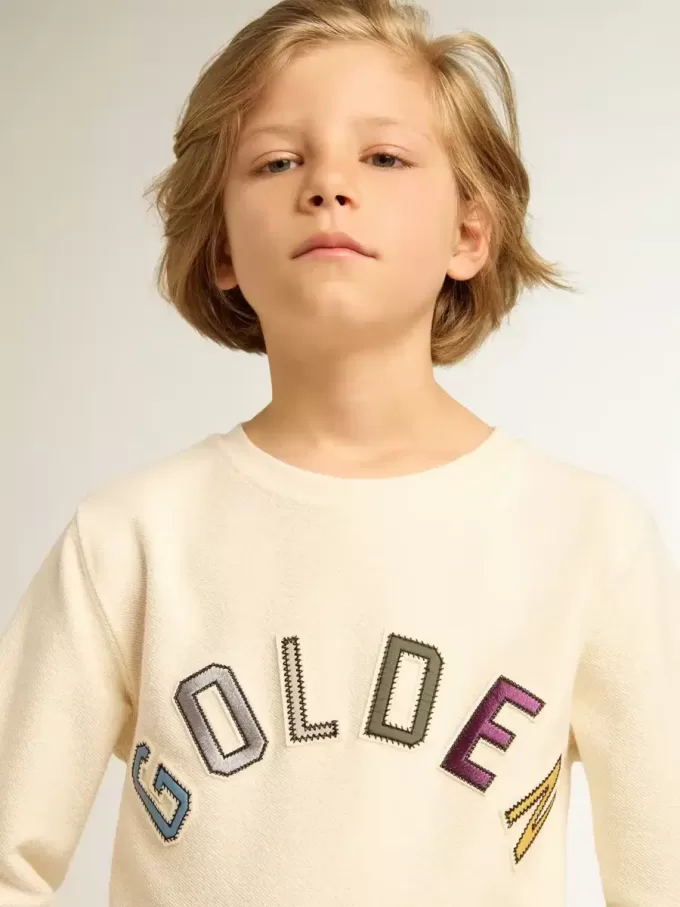 Sudadera en blanco desgastado con letras doradas multicolores en la parte delantera Sudadera en blanco desgastado con letras doradas multicolores en la parte delantera