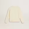 Sudadera en blanco desgastado con letras doradas multicolores en la parte delantera