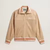 Sudadera ligera beige con cremallera y logotipo blanco para mujer Sudadera ligera beige con cremallera y logotipo blanco para mujer