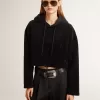Sudadera negra de chenilla para mujer con bordado en la espalda Sudadera negra de chenilla para mujer con bordado en la espalda