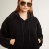 Sudadera negra de chenilla para mujer con bordado en la espalda Sudadera negra de chenilla para mujer con bordado en la espalda