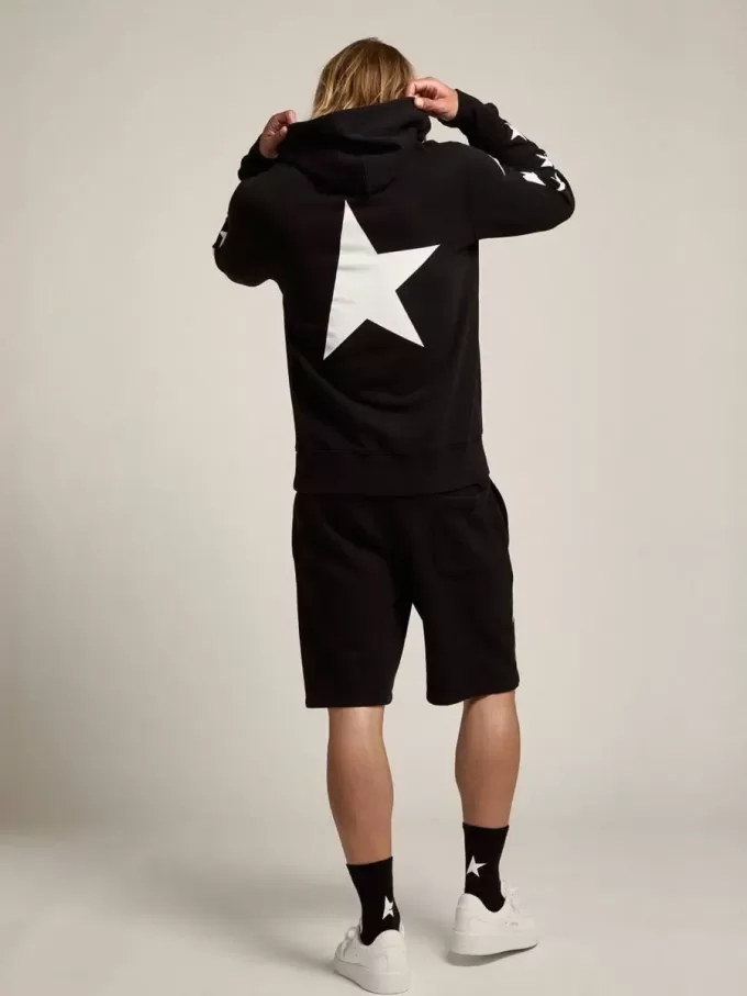 Sudadera negra de la colección Alighiero Star con estrellas blancas en contraste. Sudadera negra de la colección Alighiero Star con estrellas blancas en contraste.