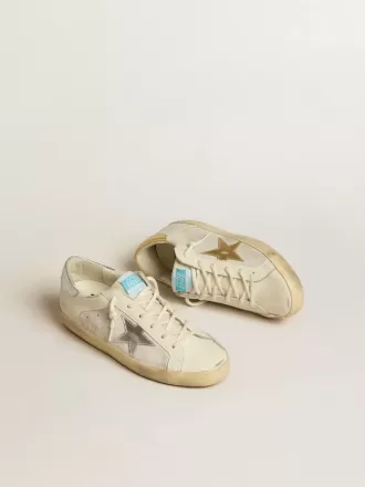 Super-Star en piel y ante blancos con estrella de piel plateada y dorada Super-Star en piel y ante blancos con estrella de piel plateada y dorada
