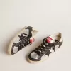 Super-Star LTD en piel metalizada con estrella e inserciones de piel negra Super-Star LTD en piel metalizada con estrella e inserciones de piel negra