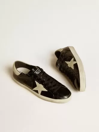 Super-Star LTD para hombre en charol negro con estrella y lengüeta en el talón de ante Super-Star LTD para hombre en charol negro con estrella y lengüeta en el talón de ante
