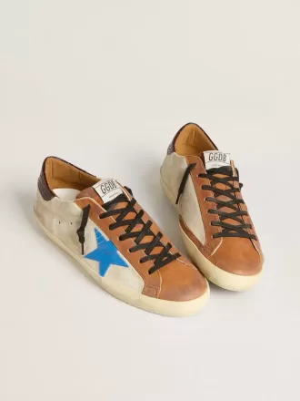 Super-Star LTD para hombre en color beige con estrella azul claro y lengüeta con estampado de cocodrilo en el talón Super-Star LTD para hombre en color beige con estrella azul claro y lengüeta con estampado de cocodrilo en el talón