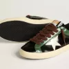 Super-Star LTD para hombre en piel laminada negra con estrella y lengüeta en el talón de piel blanca.
