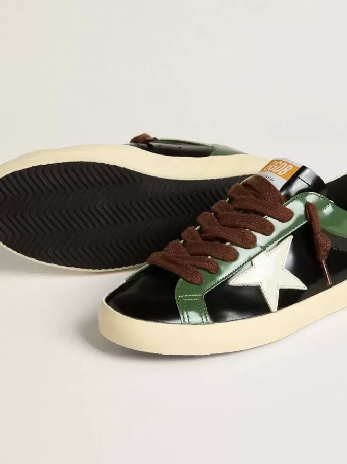 Super-Star LTD para hombre en piel laminada negra con estrella y lengüeta en el talón de piel blanca.