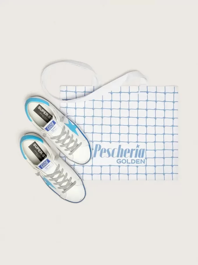 Super-Star LTD para mujer en piel blanca con estrella y lengüeta del talón en piel azul claro Super-Star LTD para mujer en piel blanca con estrella y lengüeta del talón en piel azul claro