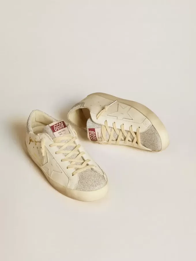 Super-Star LTD para mujer en piel blanca con inserciones de microcristales Swarovski. Super-Star LTD para mujer en piel blanca con inserciones de microcristales Swarovski.