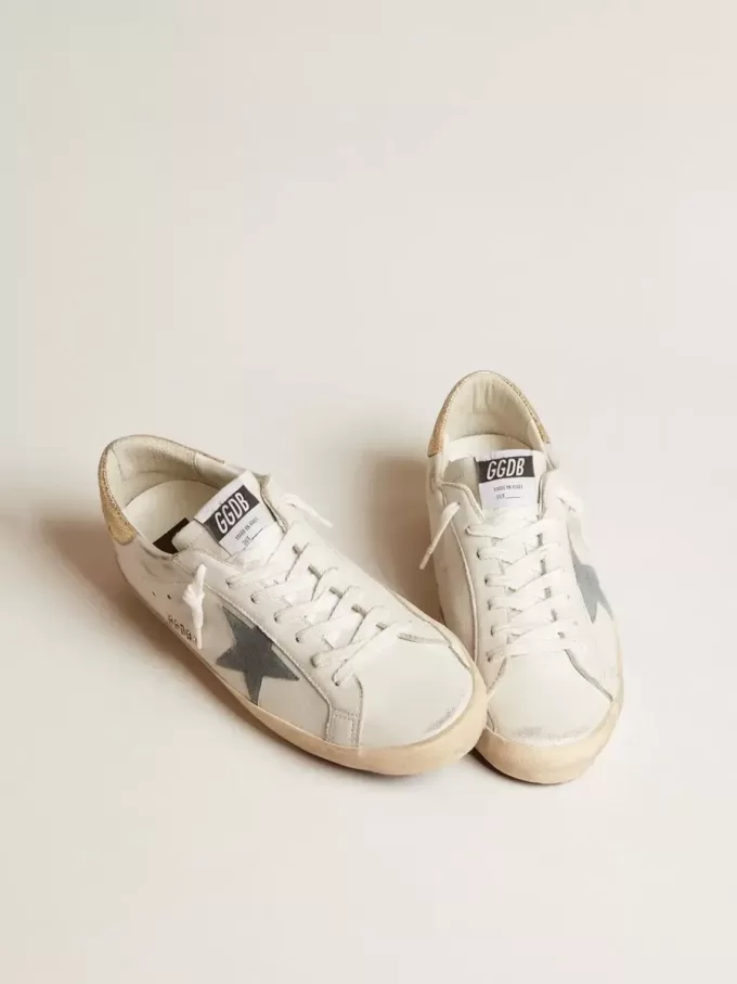 Super-Star para hombre con estrella de ante y lengüeta del talón de piel con estampado de serpiente platino Super-Star para hombre con estrella de ante y lengüeta del talón de piel con estampado de serpiente platino