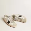 Super-Star para hombre en piel blanca con estrella de nubuck negro y lengüeta del talón en piel metalizada plateada Super-Star para hombre en piel blanca con estrella de nubuck negro y lengüeta del talón en piel metalizada plateada