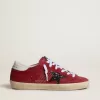 Super-Star para mujer en ante rojo con estrella brillante y lengüeta blanca en el talón Super-Star para mujer en ante rojo con estrella brillante y lengüeta blanca en el talón