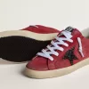 Super-Star para mujer en ante rojo con estrella brillante y lengüeta blanca en el talón Super-Star para mujer en ante rojo con estrella brillante y lengüeta blanca en el talón