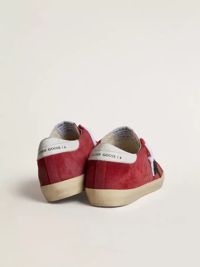Super-Star para mujer en ante rojo con estrella brillante y lengüeta blanca en el talón Super-Star para mujer en ante rojo con estrella brillante y lengüeta blanca en el talón