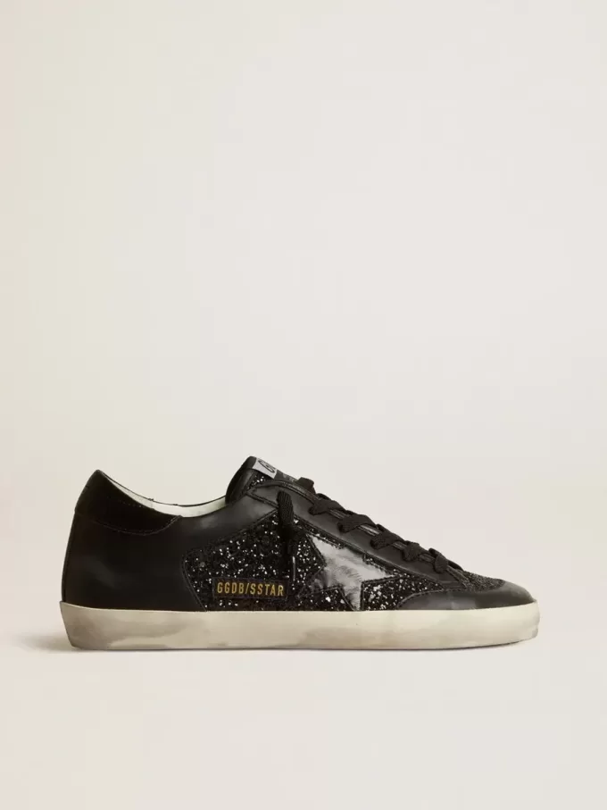 Super-Star para mujer en napa negra y purpurina con estrella de cuero negro brillante Super-Star para mujer en napa negra y purpurina con estrella de cuero negro brillante