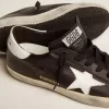 Super-Star para mujer en piel negra con estrella y lengüeta en el talón en piel blanca Super-Star para mujer en piel negra con estrella y lengüeta en el talón en piel blanca
