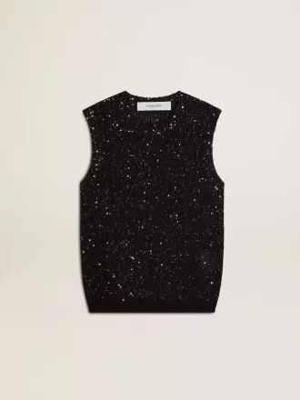 Top de malla negra con lentejuelas y detalles en contraste