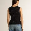 Top de malla negra con lentejuelas y detalles en contraste Top de malla negra con lentejuelas y detalles en contraste