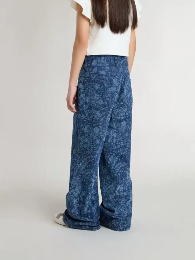 Vaqueros anchos para niña con estampado y lavado medio Vaqueros anchos para niña con estampado y lavado medio