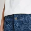 Vaqueros anchos para niña con estampado y lavado medio Vaqueros anchos para niña con estampado y lavado medio