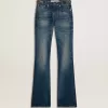 Vaqueros bootcut para mujer con lavado vintage y detalles metálicos Vaqueros bootcut para mujer con lavado vintage y detalles metálicos