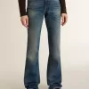 Vaqueros bootcut para mujer con lavado vintage y detalles metálicos Vaqueros bootcut para mujer con lavado vintage y detalles metálicos