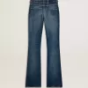 Vaqueros bootcut para mujer con lavado vintage y detalles metálicos Vaqueros bootcut para mujer con lavado vintage y detalles metálicos