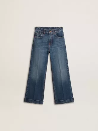 Vaqueros bootcut para niña con lavado medio y bordados Vaqueros bootcut para niña con lavado medio y bordados