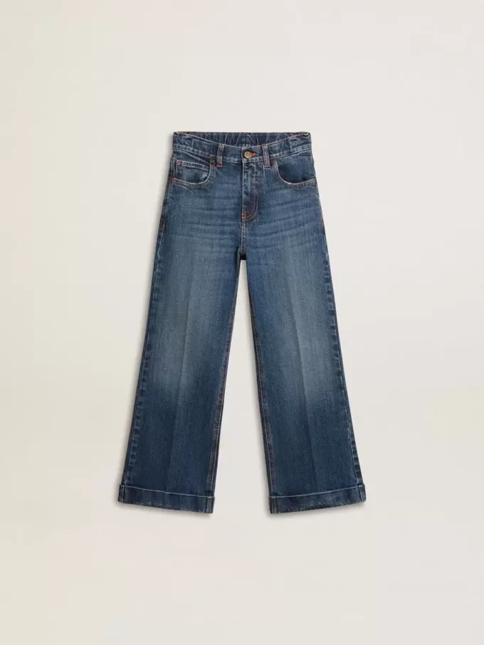 Vaqueros bootcut para niña con lavado medio y bordados Vaqueros bootcut para niña con lavado medio y bordados