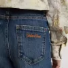 Vaqueros bootcut para niña con lavado medio y bordados Vaqueros bootcut para niña con lavado medio y bordados