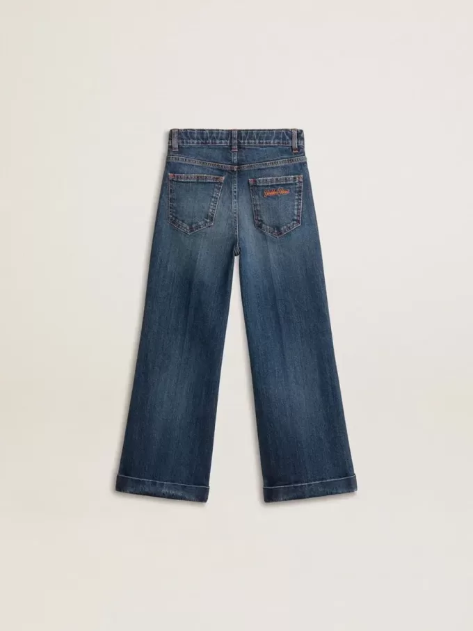 Vaqueros bootcut para niña con lavado medio y bordados Vaqueros bootcut para niña con lavado medio y bordados