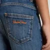 Vaqueros de denim para niño con borde sin rematar y bordados