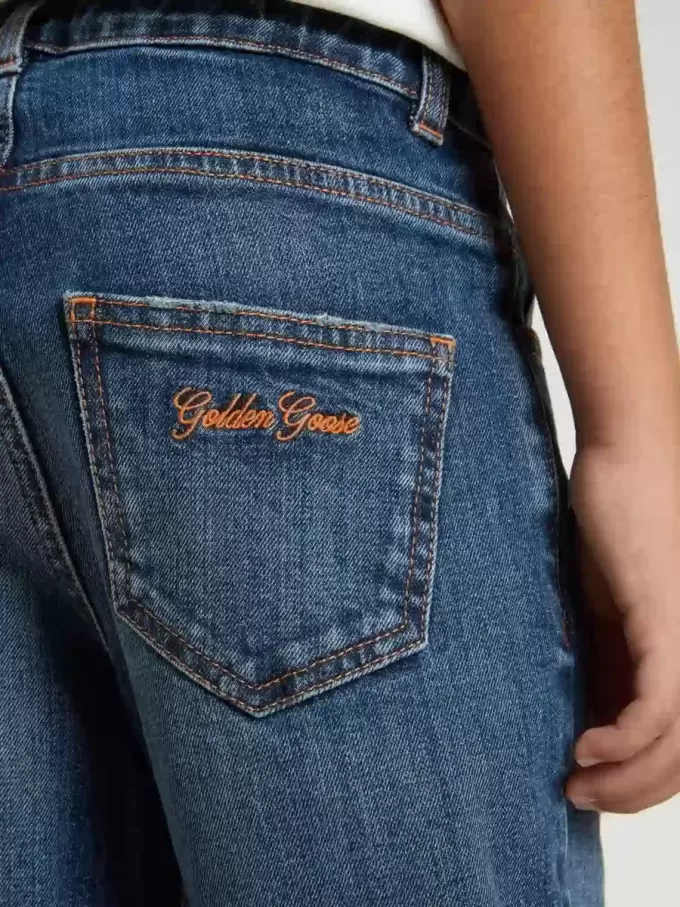 Vaqueros de denim para niño con borde sin rematar y bordados