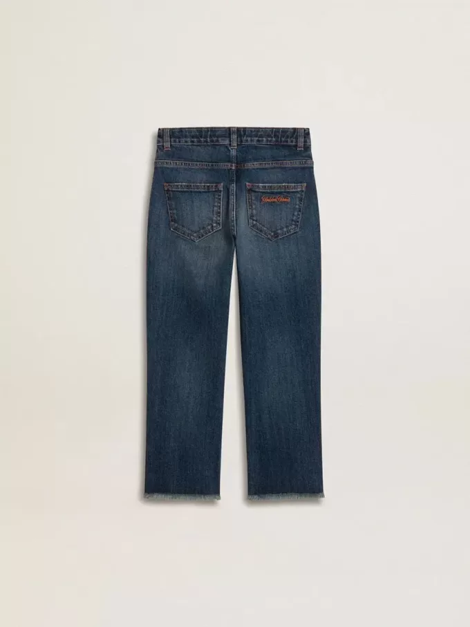 Vaqueros de denim para niño con borde sin rematar y bordados