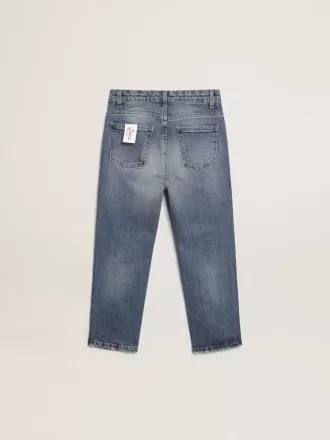 Vaqueros elásticos para niño en denim azul. Vaqueros elásticos para niño en denim azul.