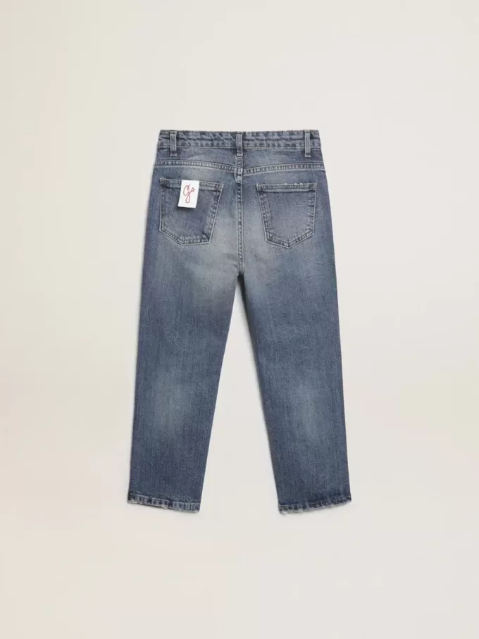 Vaqueros elásticos para niño en denim azul.