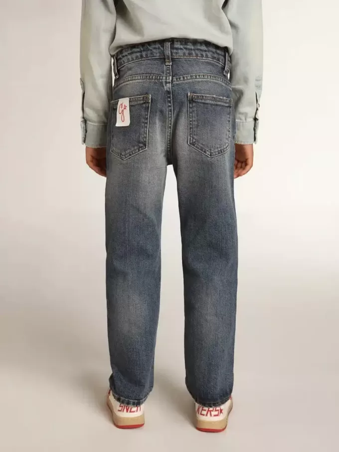 Vaqueros elásticos para niño en denim azul.