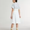 Vestido camisero para niña en lona de algodón blanca con estampado náutico azul y ribetes blancos Vestido camisero para niña en lona de algodón blanca con estampado náutico azul y ribetes blancos