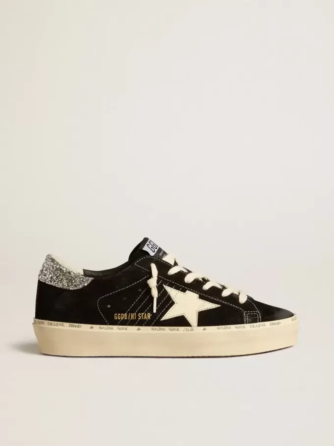 Zapatillas Hi Star para mujer en piel negra con lengüeta plateada brillante en el talón Zapatillas Hi Star para mujer en piel negra con lengüeta plateada brillante en el talón