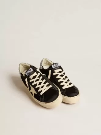 Zapatillas Hi Star para mujer en piel negra con lengüeta plateada brillante en el talón