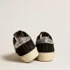 Zapatillas Hi Star para mujer en piel negra con lengüeta plateada brillante en el talón Zapatillas Hi Star para mujer en piel negra con lengüeta plateada brillante en el talón
