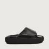 Zapatillas sin cordones Space-Star Slide para hombre en piel negra. Zapatillas sin cordones Space-Star Slide para hombre en piel negra.