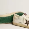 Zapatillas Super-Star para hombre con estrella de ante marrón y lengüeta rosa en el talón Zapatillas Super-Star para hombre con estrella de ante marrón y lengüeta rosa en el talón