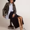 Zapatillas Super-Star para mujer con lengüeta negra en el talón y letras metálicas con tachuelas Zapatillas Super-Star para mujer con lengüeta negra en el talón y letras metálicas con tachuelas
