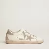 Zapatillas Super-Star para mujer con lengüeta plateada en el talón y letras metálicas con tachuelas Zapatillas Super-Star para mujer con lengüeta plateada en el talón y letras metálicas con tachuelas